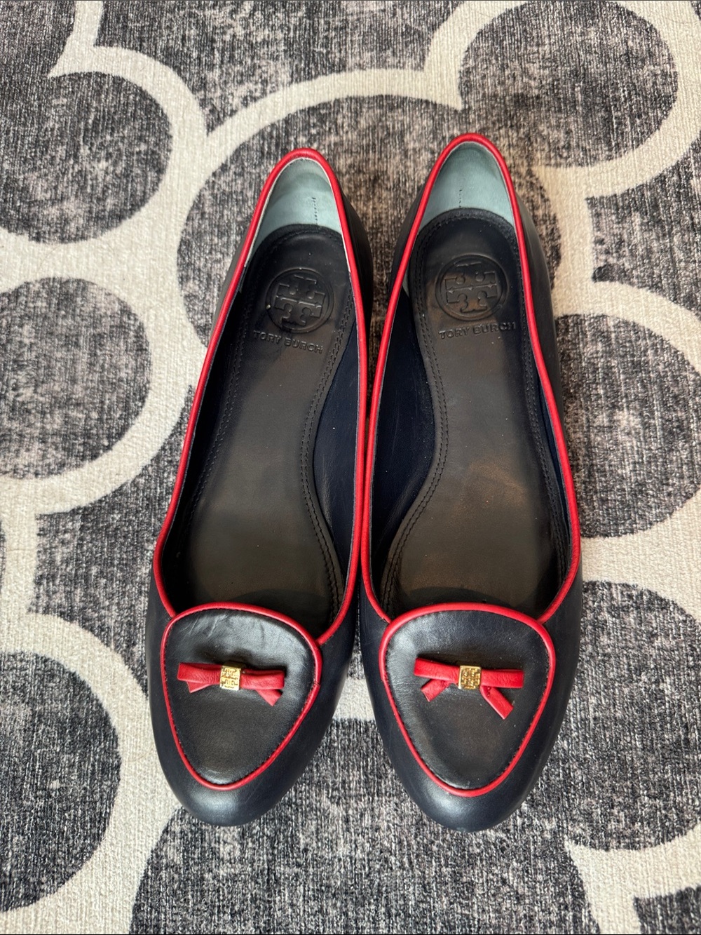 Tory Burch Black Leather Flats with Red Trim and Bow Accent